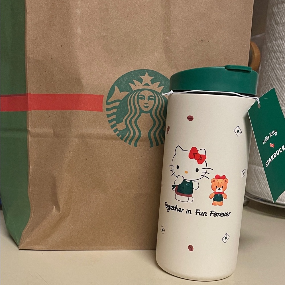 Starbucks White Tumbler with Green Lid and Hello Kitty Design